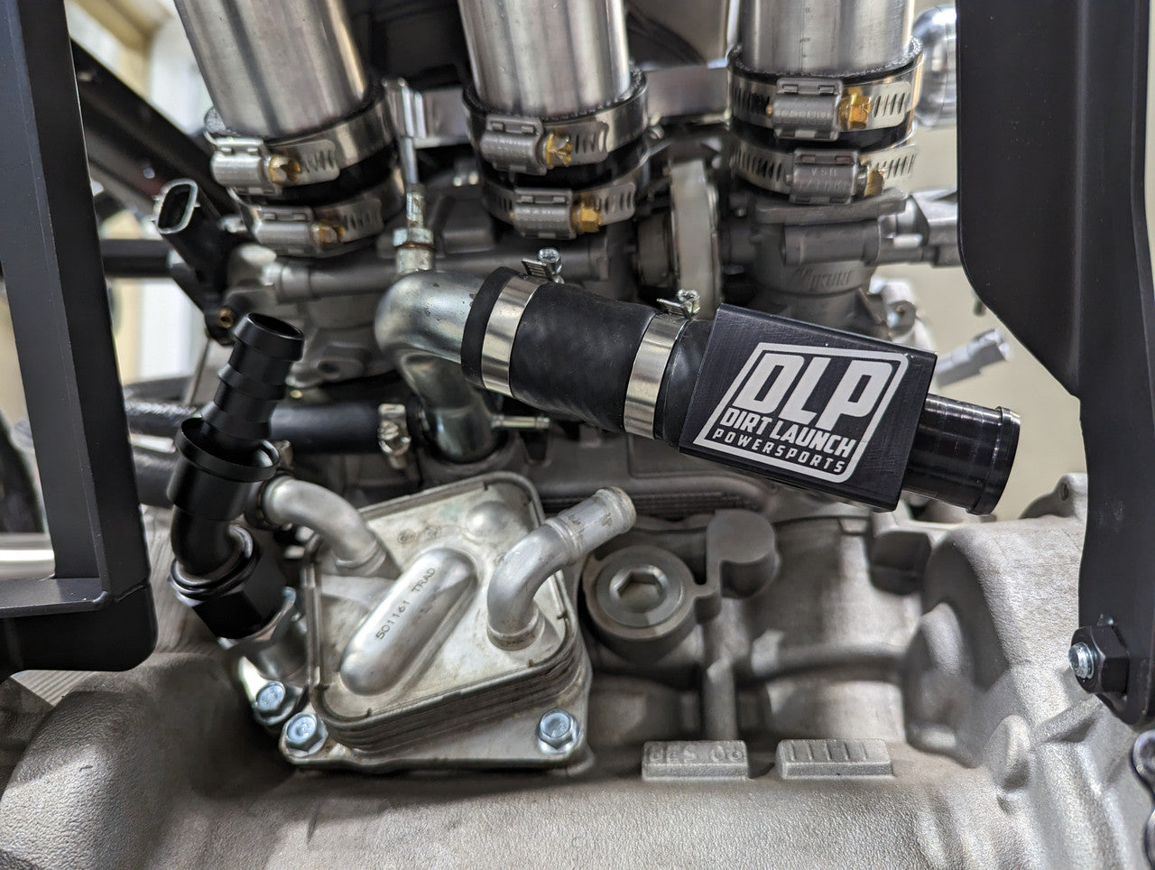 Black anodized coolant sensor block built for durability and clean installation on Yamaha YXZ1000R.