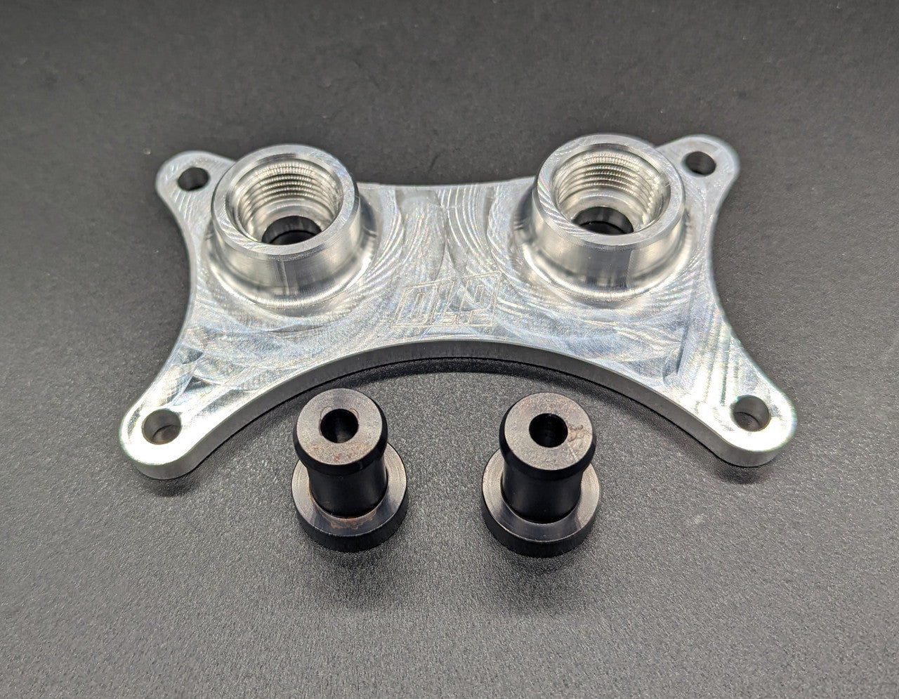Billet aluminum oil cooler adapter for Polaris RZR replacing the factory oil cooler with dual -8 ORB fittings.