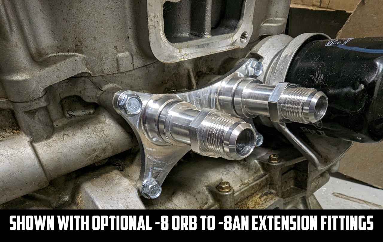 Close-up of dual -8 ORB fittings for custom oil line routing on Polaris RZR external oil cooler setup.