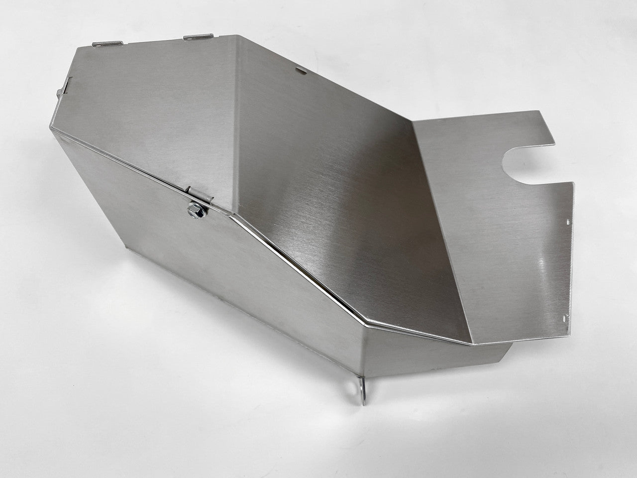 Lower intake shield fits around coolant lines to block dirt and debris from covering the air filter.